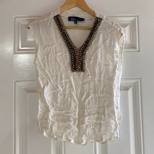 embellished cream top
